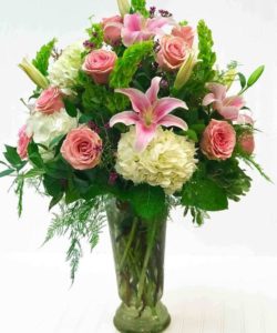 stargazer lilies, pink roses and white hydrangas with greenery