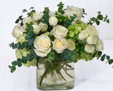 White roses nestled in beautiful hydrangea is an excellent arrangement to make anyone shine.