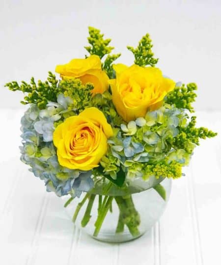 Brighten any day with a classic combination of roses and hydrangea.